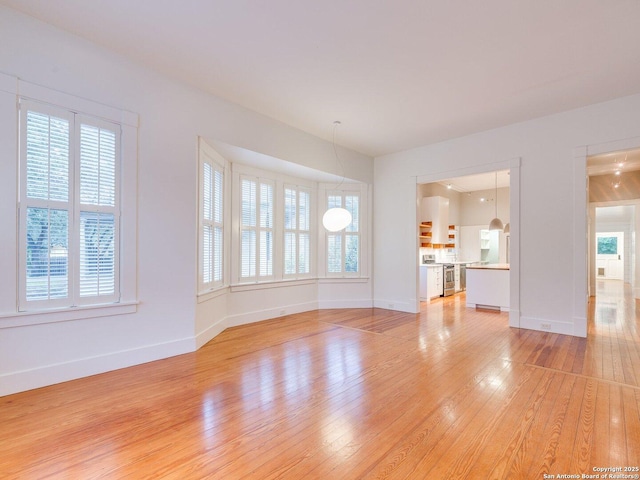 302 Cedar, San Antonio, TX 78210 - unfurnished living room featuring light wood finished floors and baseboards