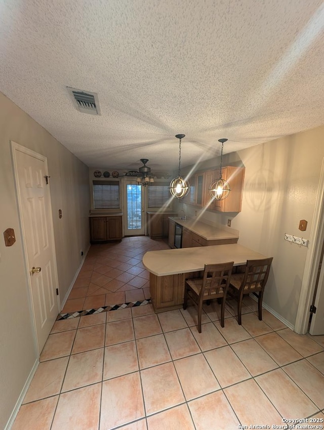 6410 Firestone, San Antonio, TX 78244 - dining room with light tile patterned floors, baseboards, a textured ceiling, and a ceiling fan