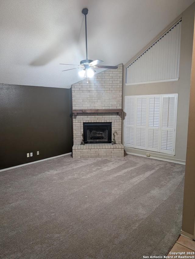 6410 Firestone, San Antonio, TX 78244 - unfurnished living room featuring a ceiling fan, lofted ceiling, carpet, baseboards, and a brick fireplace