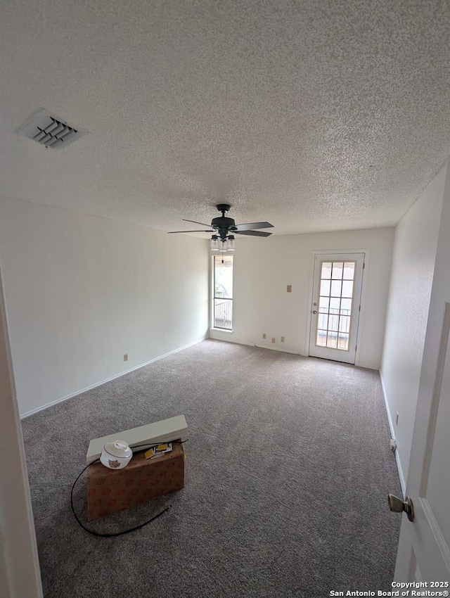 6410 Firestone, San Antonio, TX 78244 - carpeted empty room with ceiling fan and a textured ceiling