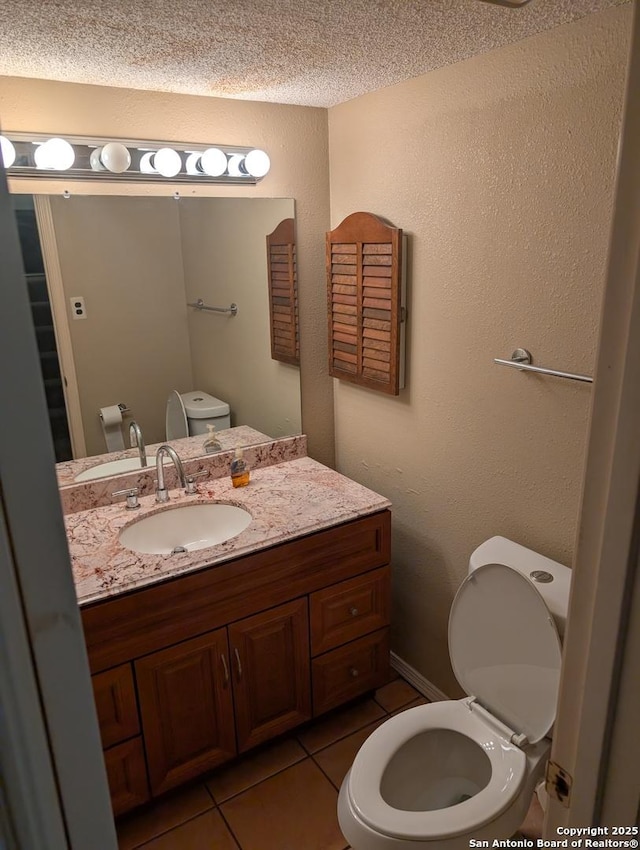 6410 Firestone, San Antonio, TX 78244 - half bath with toilet, tile patterned flooring, and vanity