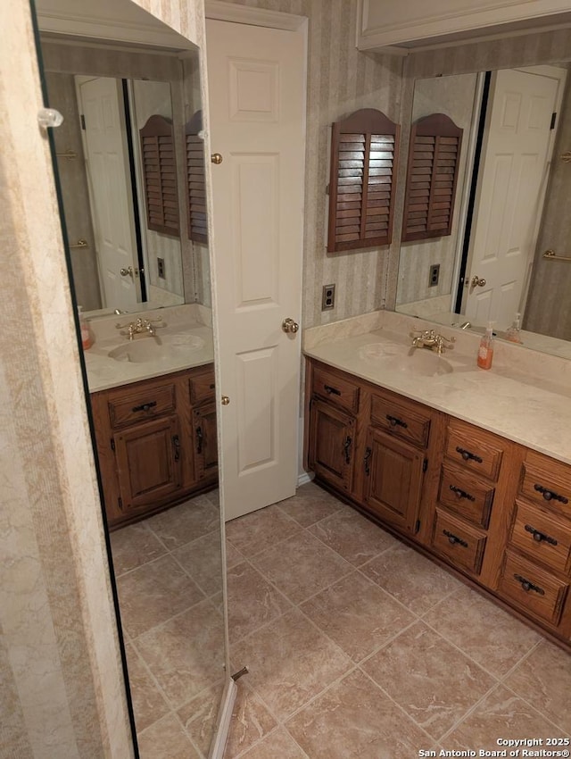 6410 Firestone, San Antonio, TX 78244 - bathroom with two vanities, wallpapered walls, and tile patterned floors