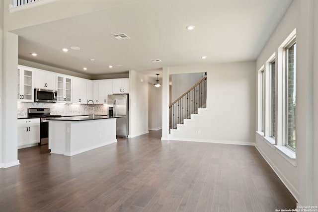12414 Mineshaft, San Antonio, TX 78254 - kitchen featuring appliances with stainless steel finishes, dark countertops, recessed lighting, tasteful backsplash, and dark wood-style floors