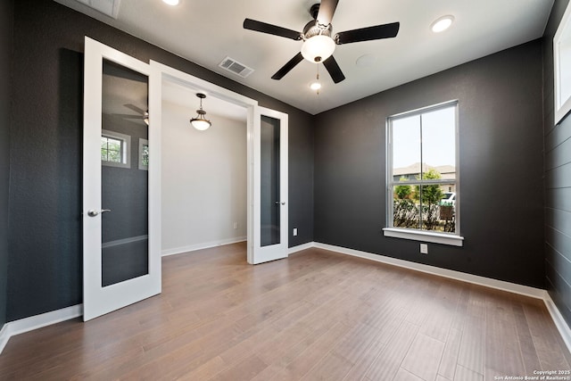 12414 Mineshaft, San Antonio, TX 78254 - spare room with french doors, a ceiling fan, wood finished floors, baseboards, and recessed lighting