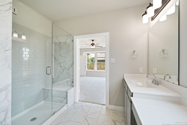 12414 Mineshaft, San Antonio, TX 78254 - bathroom with marble finish flooring, a marble finish shower, vanity, baseboards, and a ceiling fan