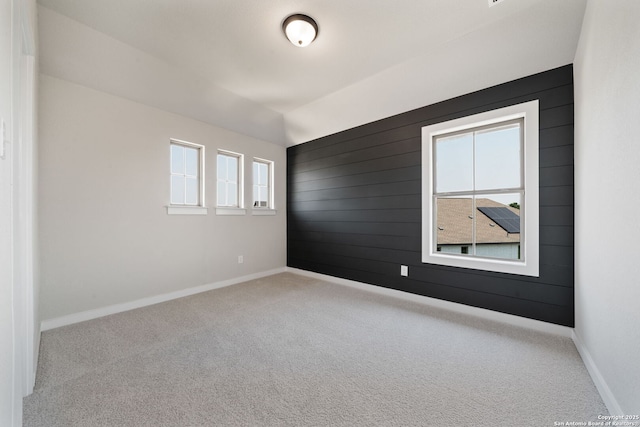 12414 Mineshaft, San Antonio, TX 78254 - carpeted empty room featuring wood walls and baseboards
