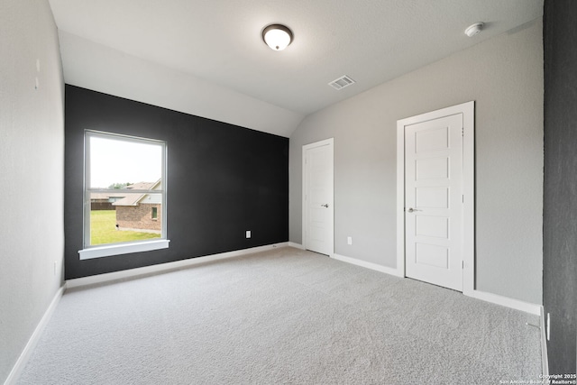12414 Mineshaft, San Antonio, TX 78254 - unfurnished bedroom featuring carpet flooring, vaulted ceiling, and baseboards
