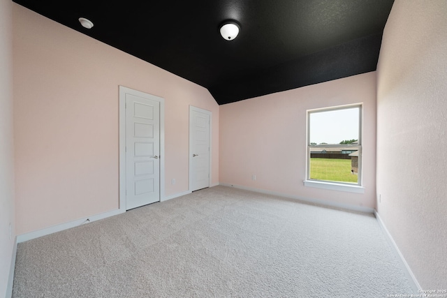 12414 Mineshaft, San Antonio, TX 78254 - unfurnished room featuring carpet floors, lofted ceiling, and baseboards