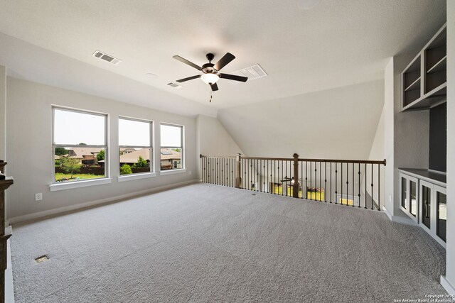 12414 Mineshaft, San Antonio, TX 78254 - additional living space with a ceiling fan, carpet flooring, and vaulted ceiling