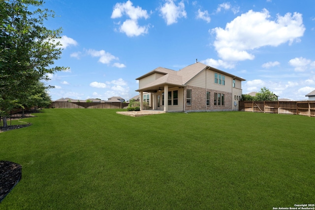 12414 Mineshaft, San Antonio, TX 78254 - back of house with brick siding and a patio