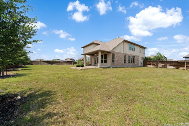 12414 Mineshaft, San Antonio, TX 78254 - rear view of property with a patio and brick siding