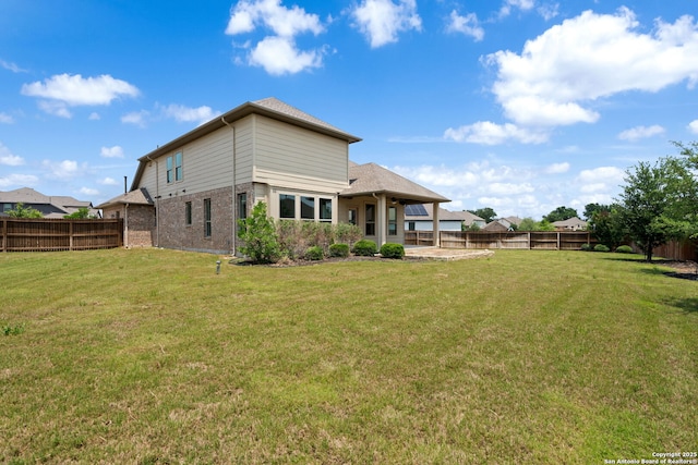 12414 Mineshaft, San Antonio, TX 78254 - back of property featuring brick siding and a patio area