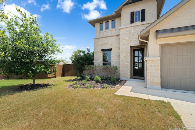 12414 Mineshaft, San Antonio, TX 78254 - view of exterior entry featuring stone siding and a garage