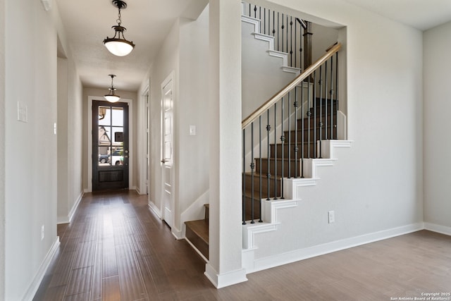 12414 Mineshaft, San Antonio, TX 78254 - entryway with dark wood-style floors, stairway, and baseboards