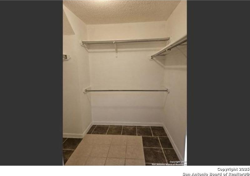 4614 Acacia Woods, San Antonio, TX 78249 - spacious closet with tile patterned floors