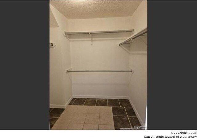 4614 Acacia Woods, San Antonio, TX 78249 - spacious closet with tile patterned floors
