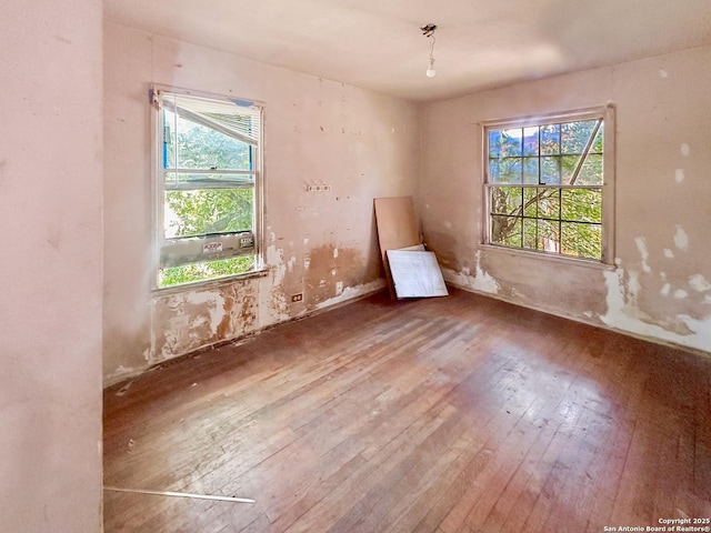 235 Notre Dame, San Antonio, TX 78228 - unfurnished room featuring hardwood / wood-style floors and healthy amount of natural light
