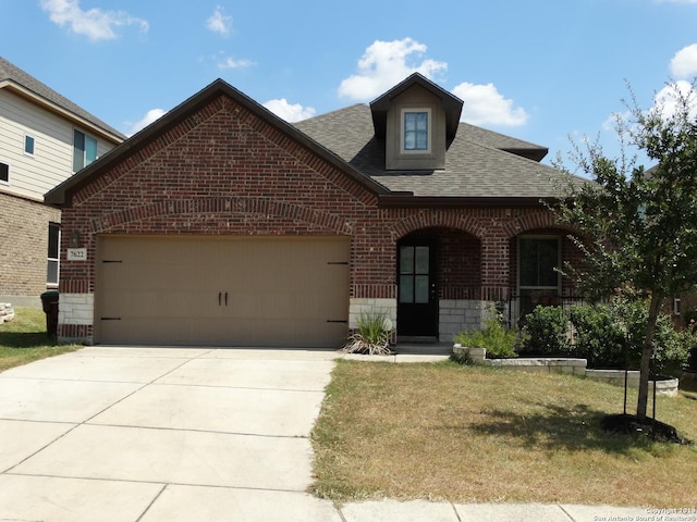 7622 Ruger Rnch, San Antonio, TX 78254 - view of front of home featuring brick siding, roof with shingles, a front lawn, driveway, and covered porch