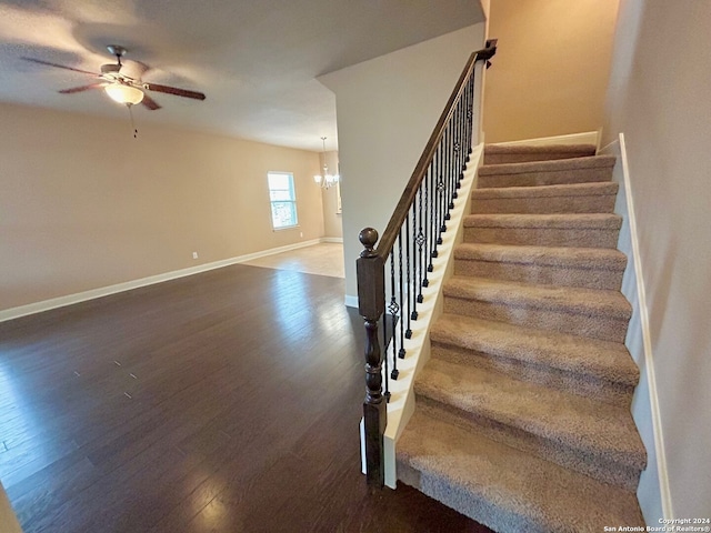 7622 Ruger Rnch, San Antonio, TX 78254 - stairs with wood finished floors, ceiling fan, baseboards, and a chandelier