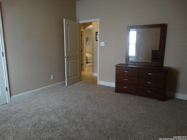 7622 Ruger Rnch, San Antonio, TX 78254 - carpeted bedroom with baseboards and arched walkways