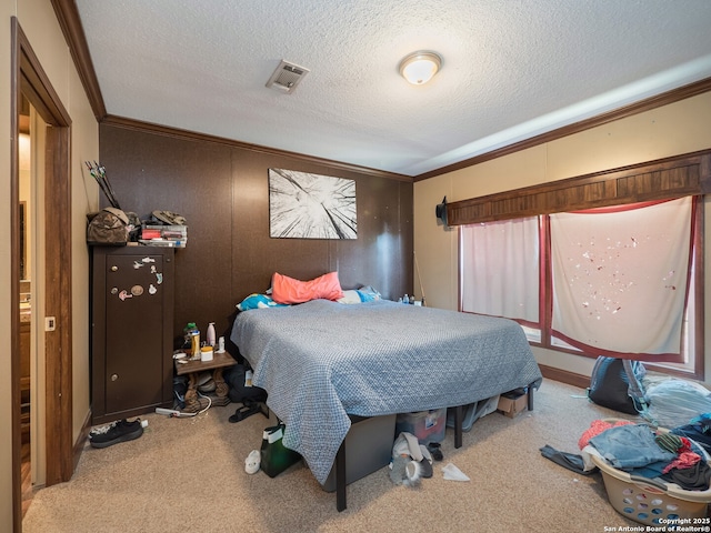 15411 Cranes Mill Rd, Canyon Lake, TX 78133 - bedroom featuring ornamental molding, carpet, and a textured ceiling