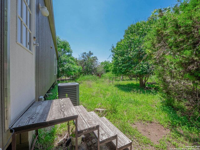 15411 Cranes Mill Rd, Canyon Lake, TX 78133 - view of yard with central air condition unit