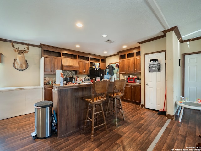 15411 Cranes Mill Rd, Canyon Lake, TX 78133 - kitchen with crown molding, open shelves, freestanding refrigerator, a center island, and dark wood-style floors