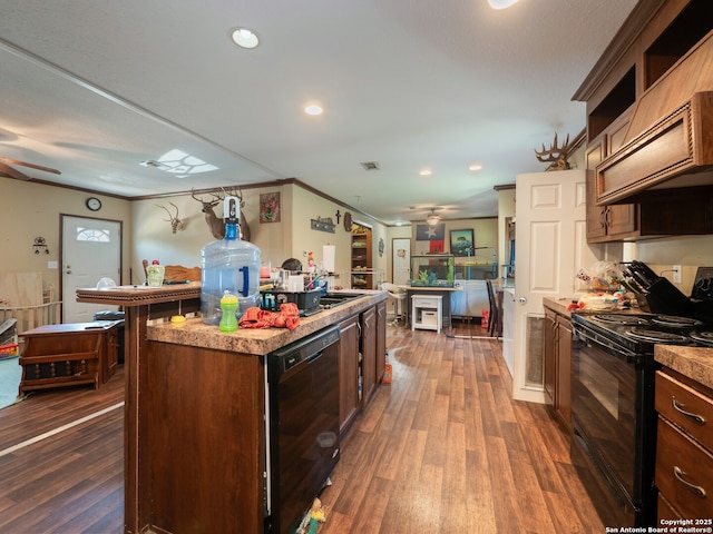 15411 Cranes Mill Rd, Canyon Lake, TX 78133 - kitchen with black appliances, a ceiling fan, dark wood-style floors, a center island, and recessed lighting
