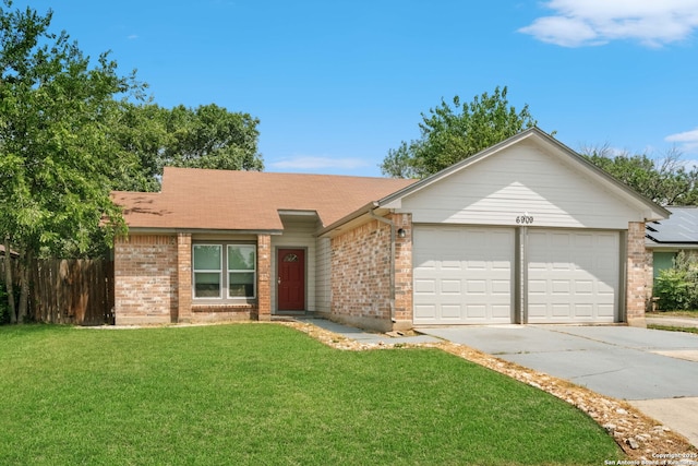 6909 Quail Lk, San Antonio, TX 78244 - view of front facade featuring brick siding, driveway, and an attached garage