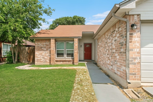 6909 Quail Lk, San Antonio, TX 78244 - entrance to property featuring brick siding, an attached garage, and a shingled roof