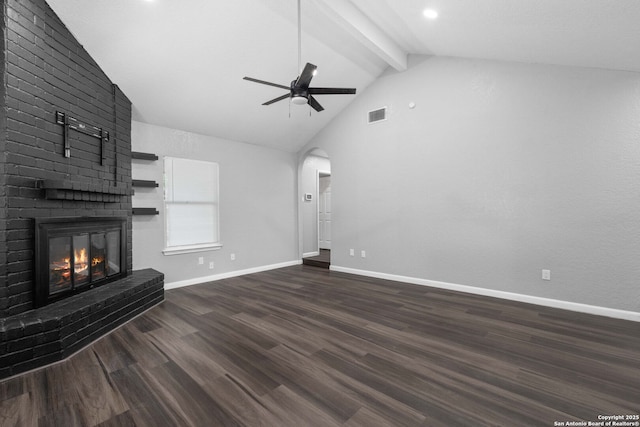 6909 Quail Lk, San Antonio, TX 78244 - unfurnished living room featuring ceiling fan, beamed ceiling, a fireplace, wood finished floors, and baseboards