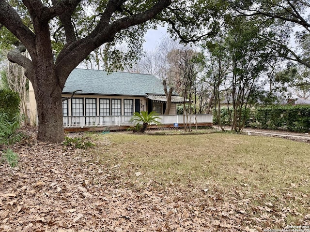 425 Canterbury Hill St, Terrell Hills, TX 78209 - back of property featuring a yard and roof with shingles