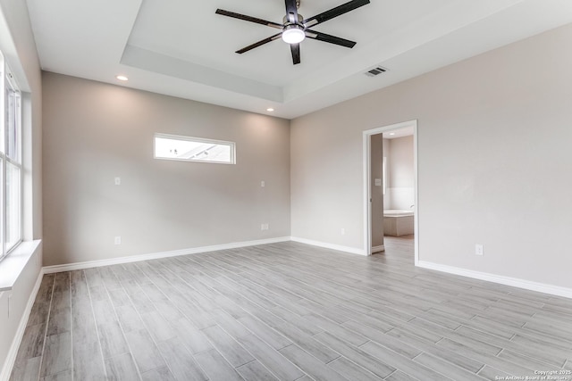 13508 Cranbrook, Live Oak, TX 78233 - empty room featuring ceiling fan, a raised ceiling, light wood finished floors, baseboards, and recessed lighting