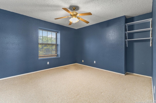 1605 W Winnipeg, San Antonio, TX 78225 - unfurnished bedroom with carpet, baseboards, a ceiling fan, and a textured ceiling