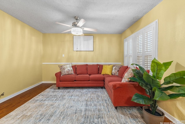 1605 W Winnipeg, San Antonio, TX 78225 - living area featuring wood finished floors, a textured ceiling, baseboards, and ceiling fan