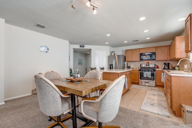11014 Palomino, San Antonio, TX 78245 - dining area featuring recessed lighting, light carpet, baseboards, and a textured ceiling