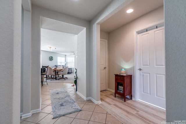 11014 Palomino, San Antonio, TX 78245 - hall featuring light tile patterned flooring, baseboards, and recessed lighting