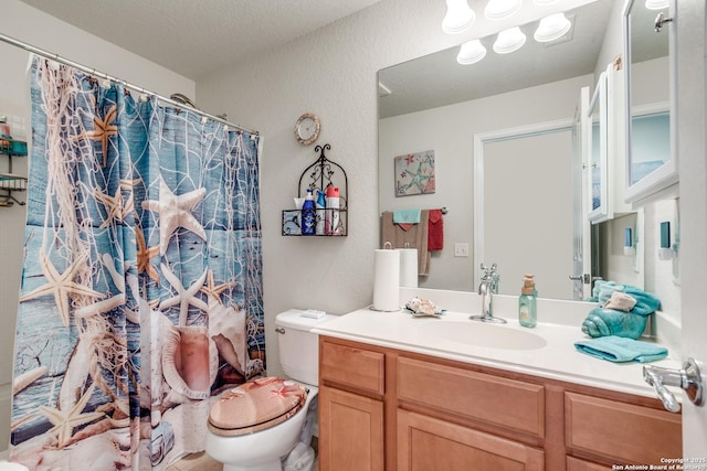 11014 Palomino, San Antonio, TX 78245 - full bath with toilet, vanity, a textured wall, and a shower with curtain