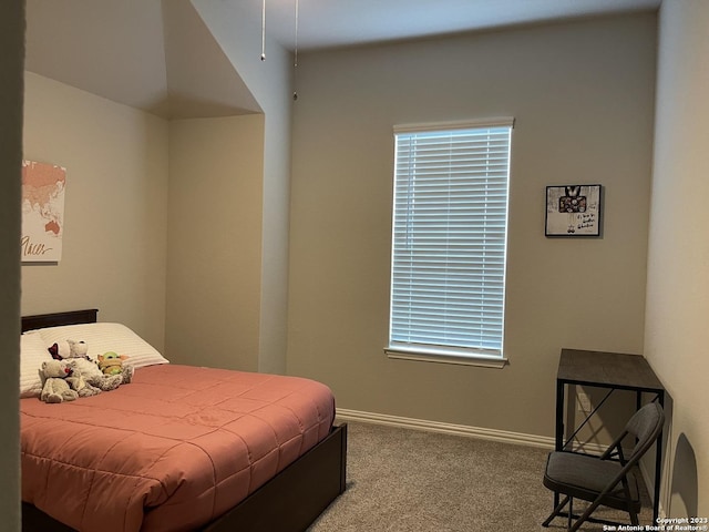 carpeted bedroom with baseboards