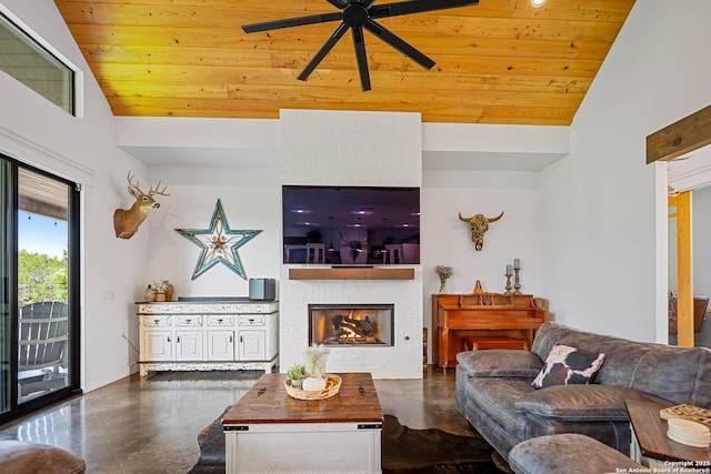 340 Warbler, Spring Branch, TX 78070 - living room featuring vaulted ceiling, ceiling fan, wooden ceiling, concrete flooring, and a brick fireplace