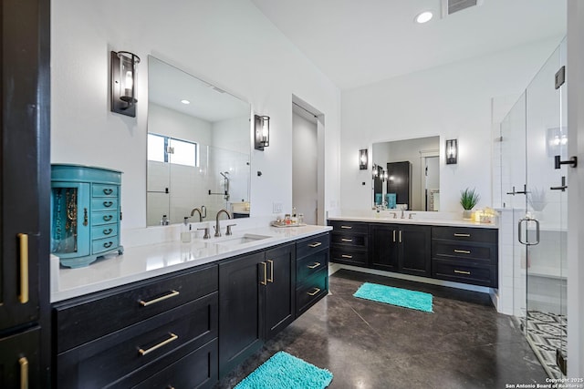 340 Warbler, Spring Branch, TX 78070 - bathroom with finished concrete floors, a stall shower, and two vanities