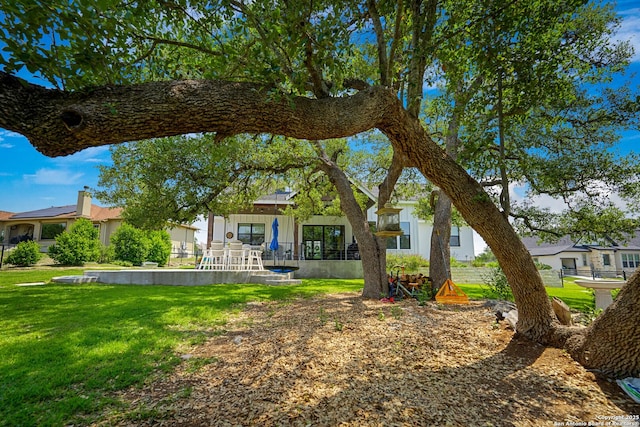 340 Warbler, Spring Branch, TX 78070 - rear view of house with a lawn and board and batten siding