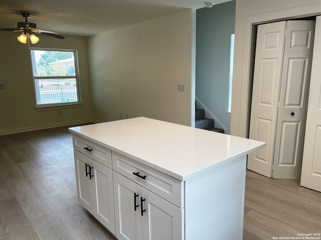 620 Euclid, San Antonio, TX 78212 - kitchen featuring light wood-type flooring, a ceiling fan, white cabinetry, and light countertops