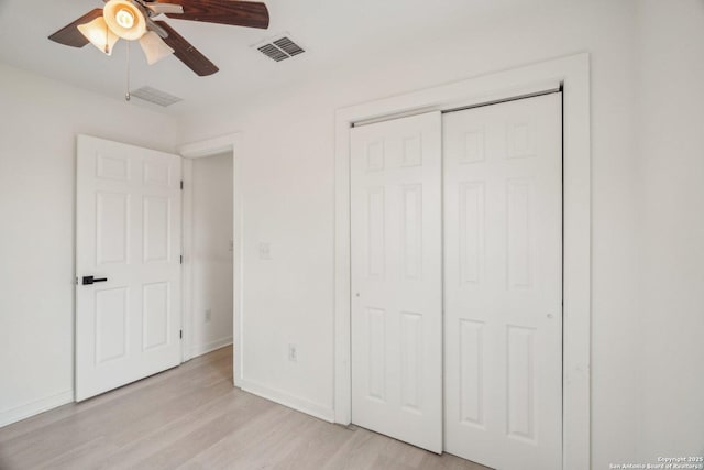 620 Euclid, San Antonio, TX 78212 - unfurnished bedroom with light wood-style flooring, a closet, and a ceiling fan