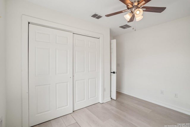 620 Euclid, San Antonio, TX 78212 - unfurnished bedroom with light wood-style flooring, a closet, and ceiling fan