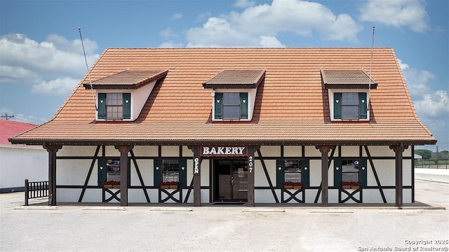 354 Lacey Oak, Castroville, TX 78009 - view of front of house featuring a tiled roof