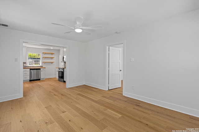 20505 Flat Creek Dr, Chandler, TX 75758 - unfurnished living room featuring light wood-type flooring, ceiling fan, and baseboards