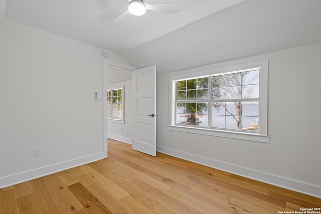 20505 Flat Creek Dr, Chandler, TX 75758 - spare room featuring vaulted ceiling, baseboards, light wood-type flooring, and a ceiling fan