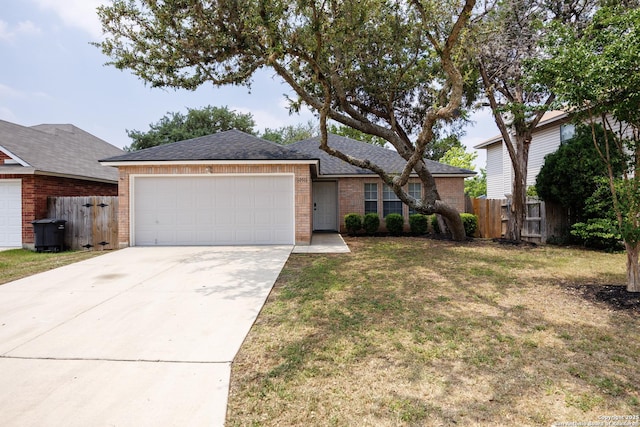 10511 Stone Crk, San Antonio, TX 78254 - view of front of house with an attached garage, brick siding, driveway, and roof with shingles