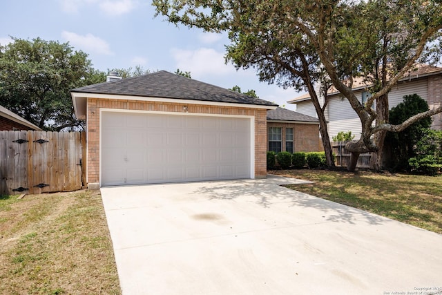 10511 Stone Crk, San Antonio, TX 78254 - view of front facade featuring brick siding, fence, concrete driveway, an outdoor structure, and a shingled roof